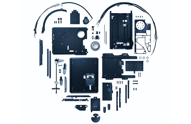 Parts of a Turny Low Vehicle laid out in the shape of a heart. 