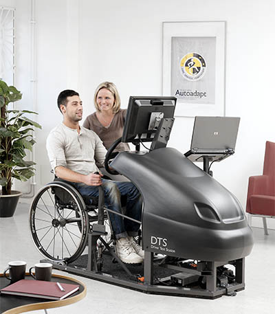 Man sitting in a DTS with a woman beside him